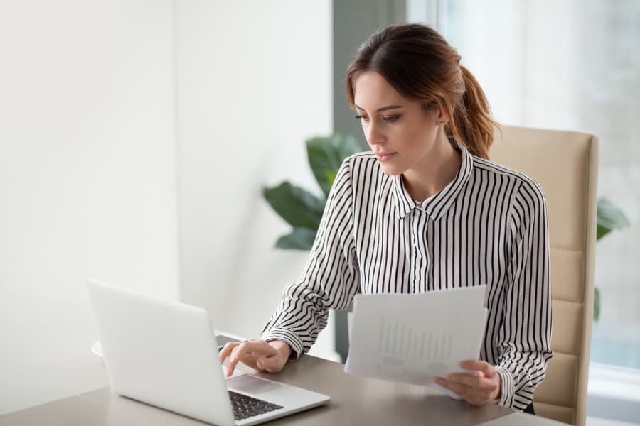 Woman researching insurance on computer