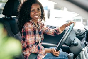 Young person driving car